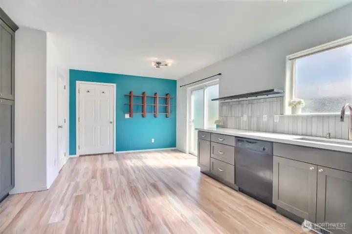 Space for a breakfast table and entry to the garage. The door to the powder room is on the left