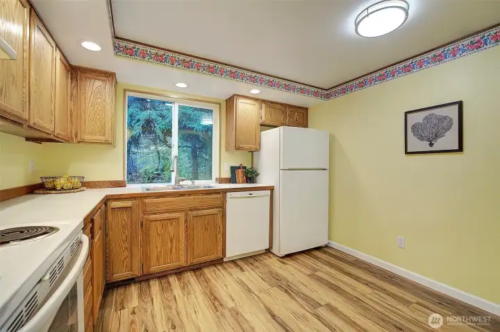 Kitchen features plenty of cabinet space and all the appliances stay.