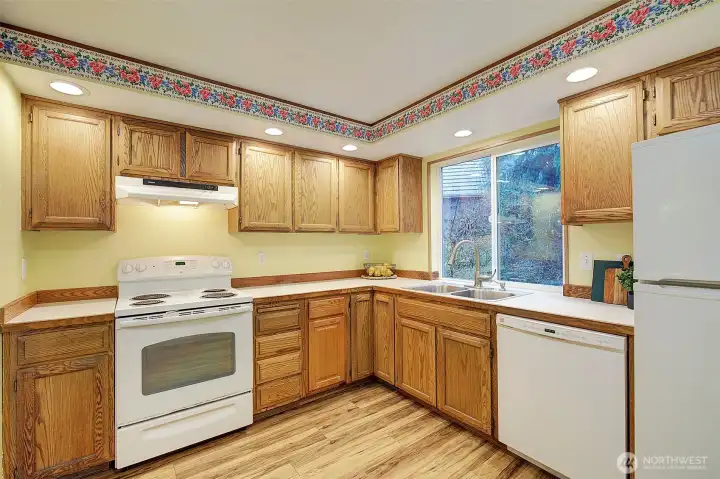 The window in the kitchen looks out onto the beautiful private yard.