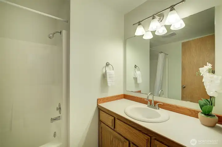 Main bath in upstairs hallway.
