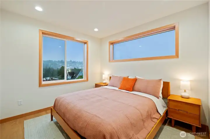 Primary suite on the upper level. Imagine a clear day - views of Mt Rainier and downtown Seattle.