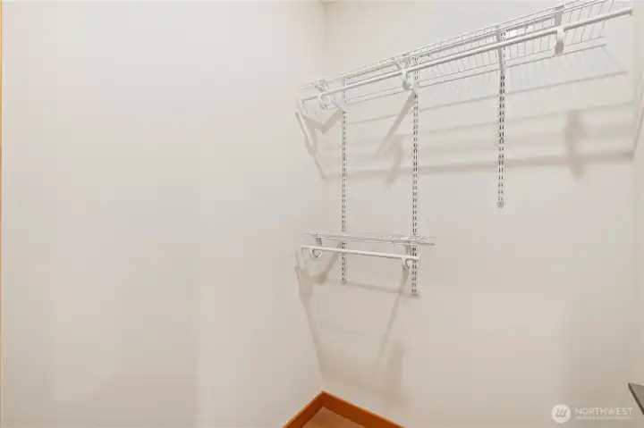 Walk-in closet in the primary suite.