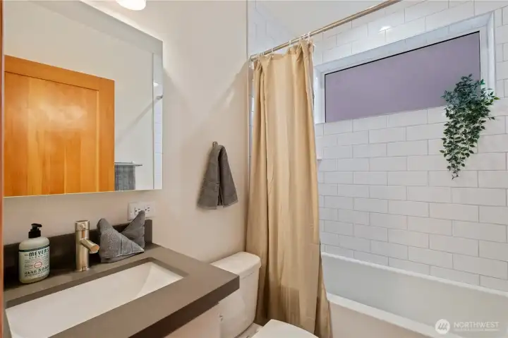 Full bath on the upper level with heated tile floors.