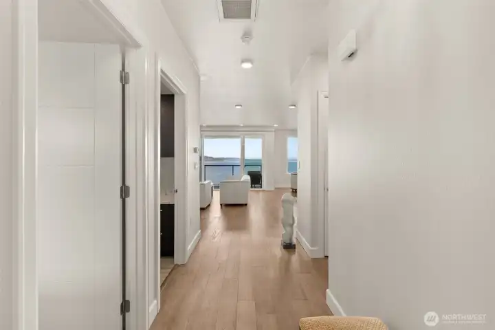 Wide-plank wooden floors lead your directly to your spectacular view.