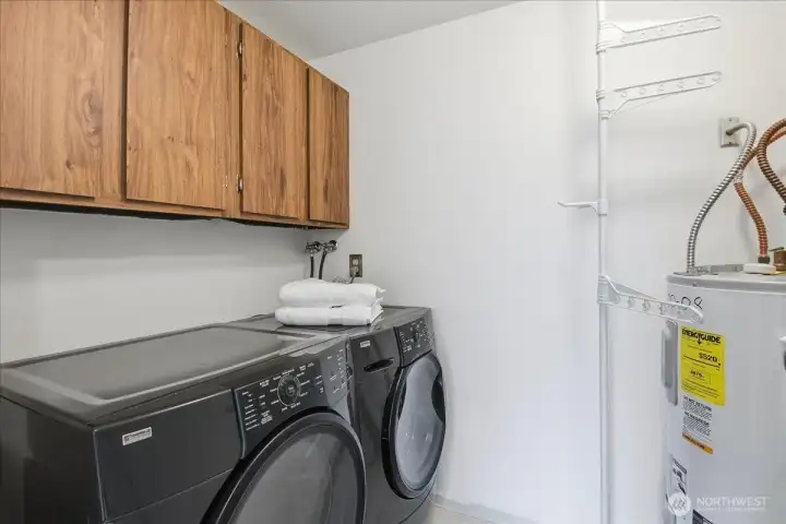 Large laundry room with lots of storage!  Washer and dryer included.