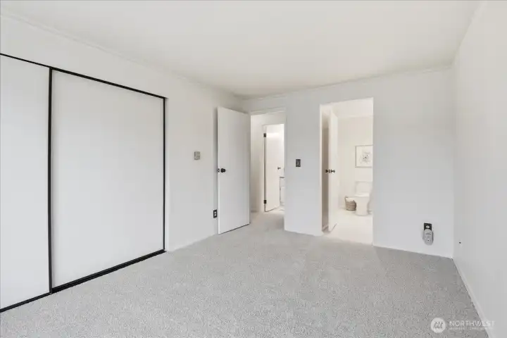 Access to hall and additional vanity from primary room.