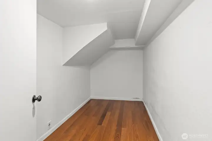 Large finished room across from Office/Den behind wet bar downstairs.