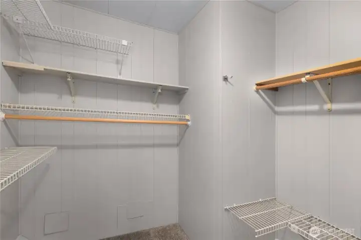 Fantastic sized walk in closet in primary bedroom. Expansive storage with built in racks.