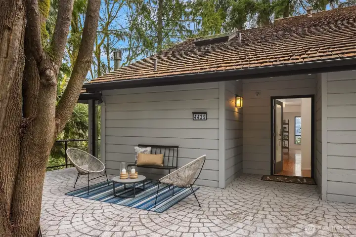Inviting entry patio with peaceful wooded surroundings