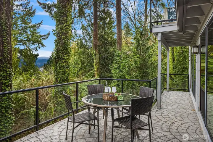 Private outdoor deck immersed in lush Northwest greenery, perfect for relaxed outdoor living and views of Lake Washington