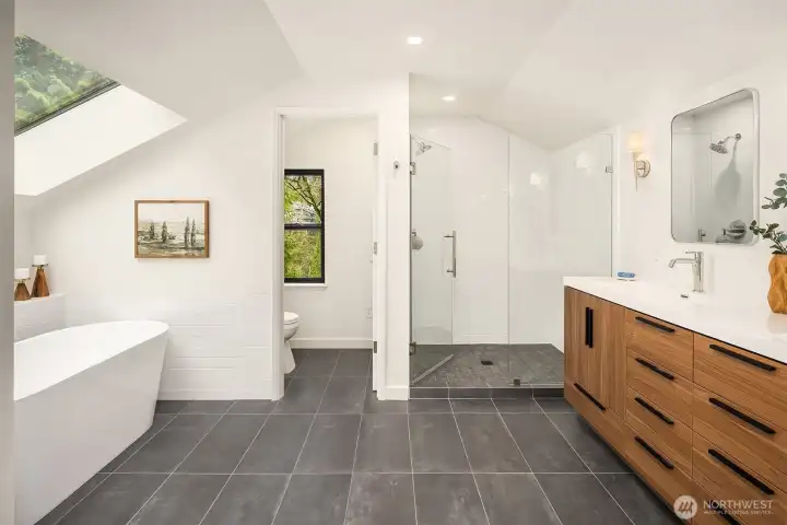 Completely reimagined in 2026, this spa-inspired primary bath features a freestanding soaking tub, oversized glass shower, and modern double vanity