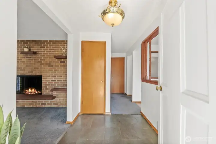 Front entrance showcasing a slate floor and vintage door bell long chimes
