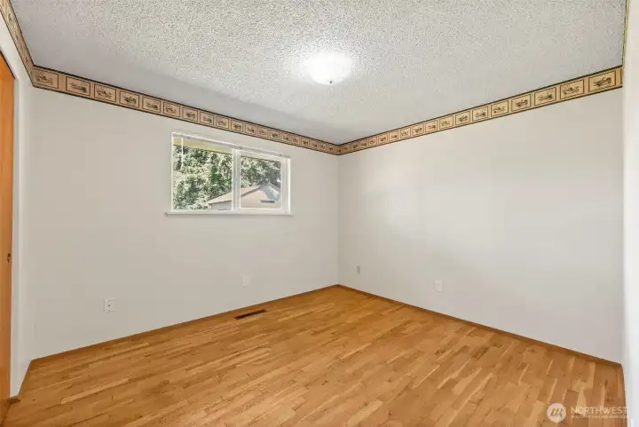 Bedroom 1 with hardwood floors