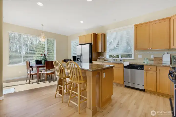 Light-filled kitchen with eat-in nook and open flow to the living room