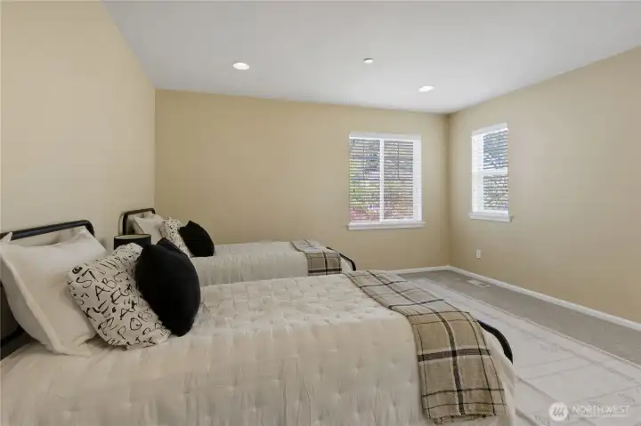 Well-sized bedroom easily accommodating dual twin beds