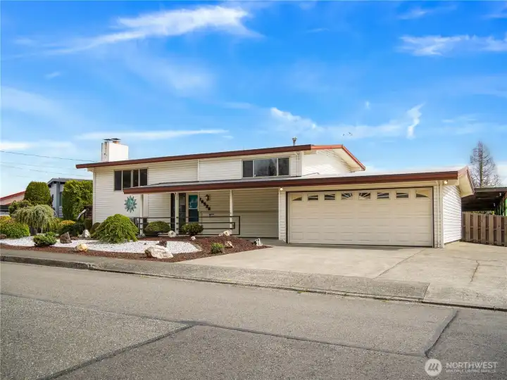 Ample driveway parking is available, plus the side gate opens to an extended driveway all the way back to the enormous covered RV/boat parking.