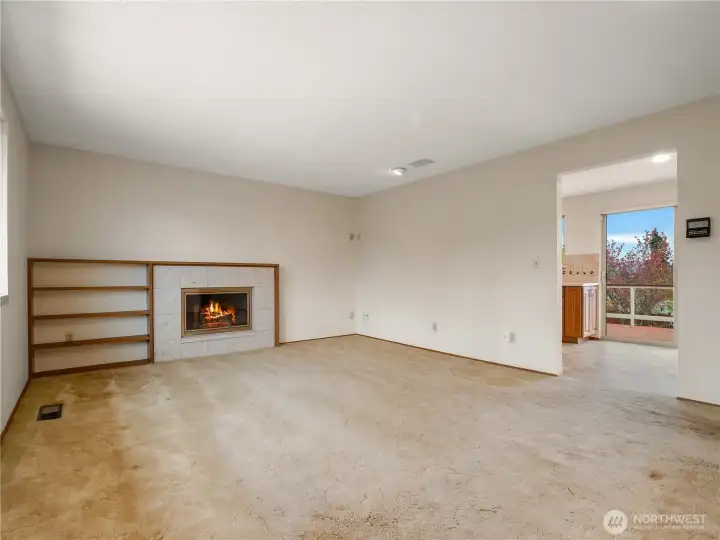 The family room is spacious with a large picture window overlooking the front yard and a cozy gas fireplace that will add ambiance for any occasion.