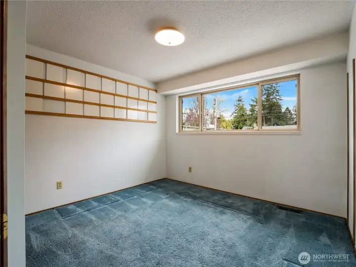 The third bedroom on the upper floor has a nice big closet and overlooks the front yard area.