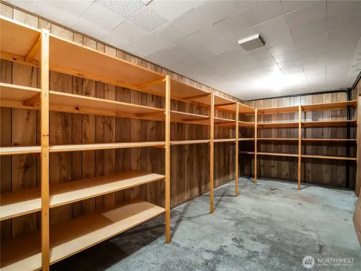 There is a large separate storage room off of the main storage/utility space. This room is complete with built-in shelving as well. As the saying goes, "You can never have enough storage!" This home might be the exception!!