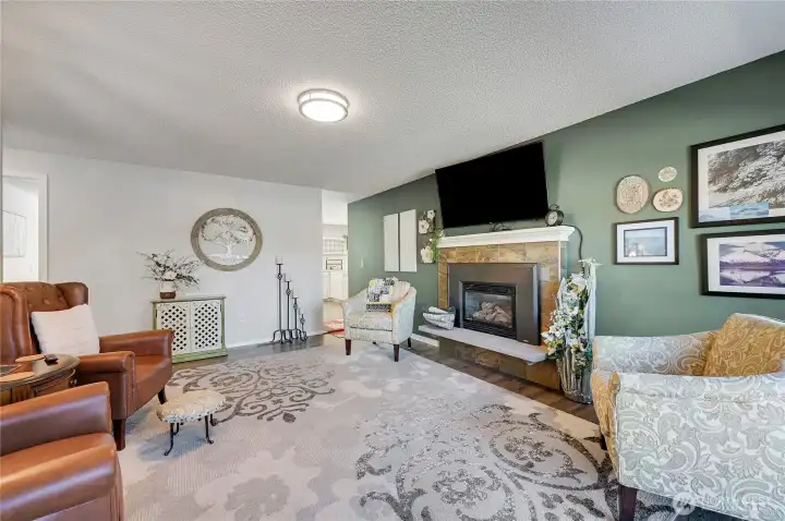 The cozy living room with gas fireplace.
