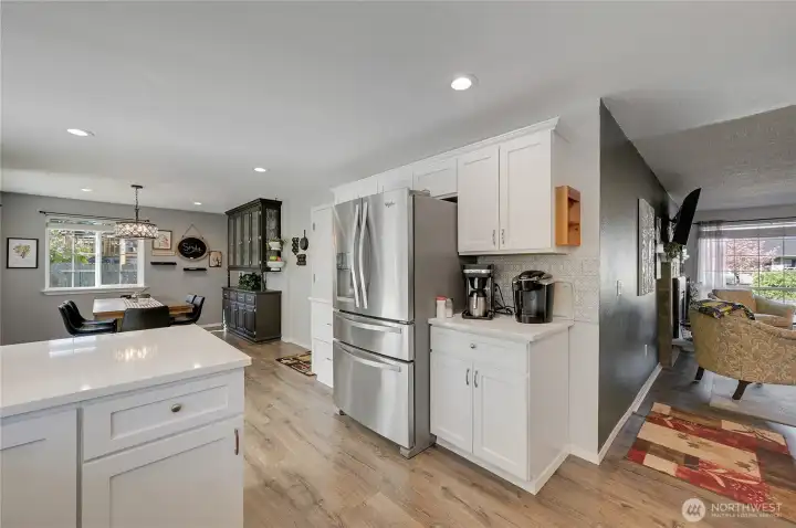 The kitchen is central to the living and dining rooms.