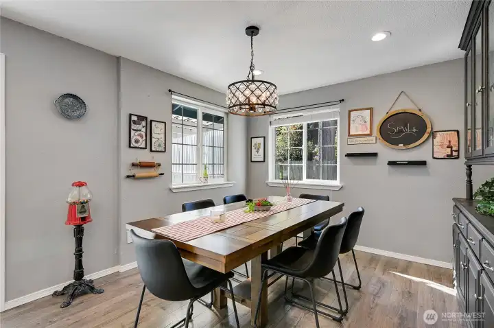 The dining room has corner windows, lots of natural light.