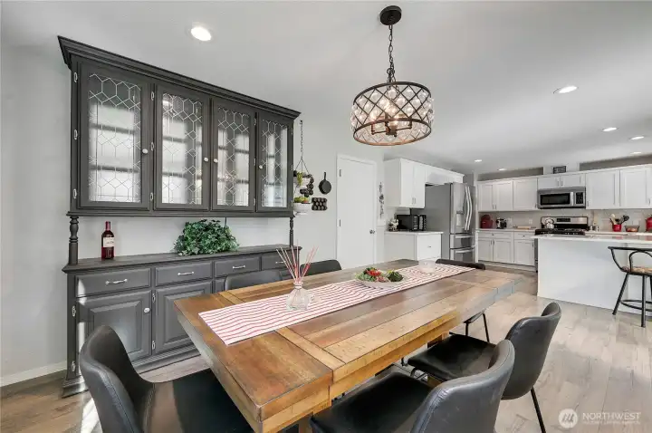 A great picture of the dining room flowing too the kitchen.