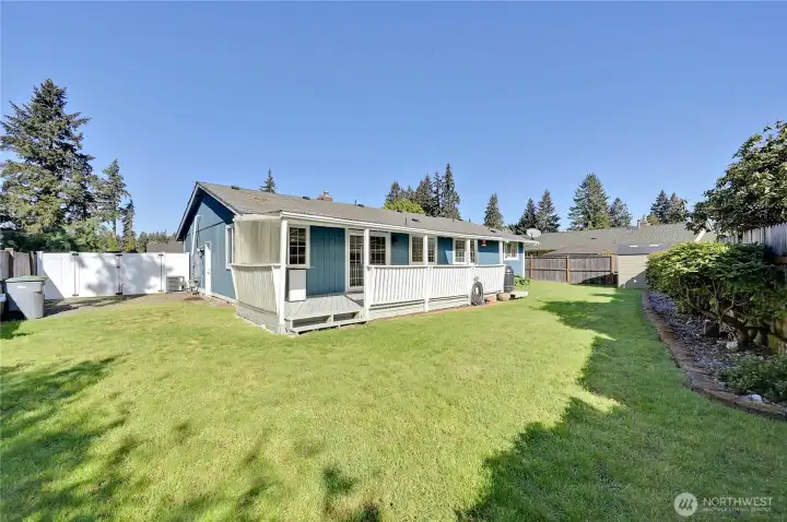 The back yard is tastefully landscaped.