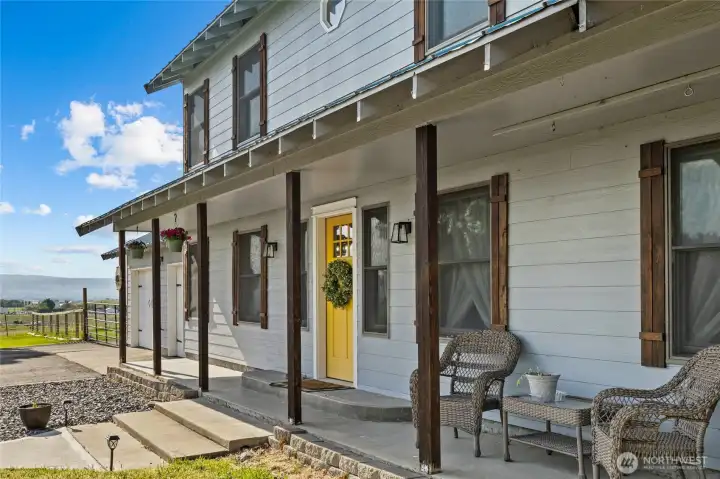 Farmhouse vibe with beautiful covered front porch.