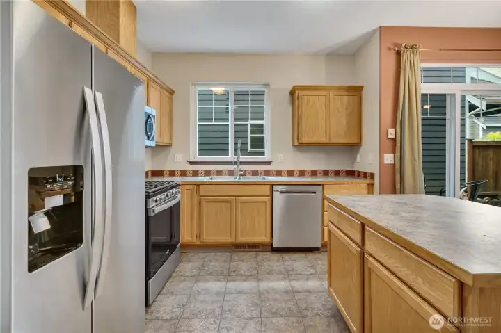 Large kitchen with stainless appliances purchased in 2024.