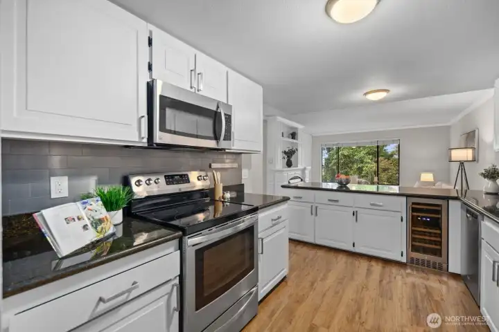 Kitchen between Family Room, Dining Room and Living Rooms