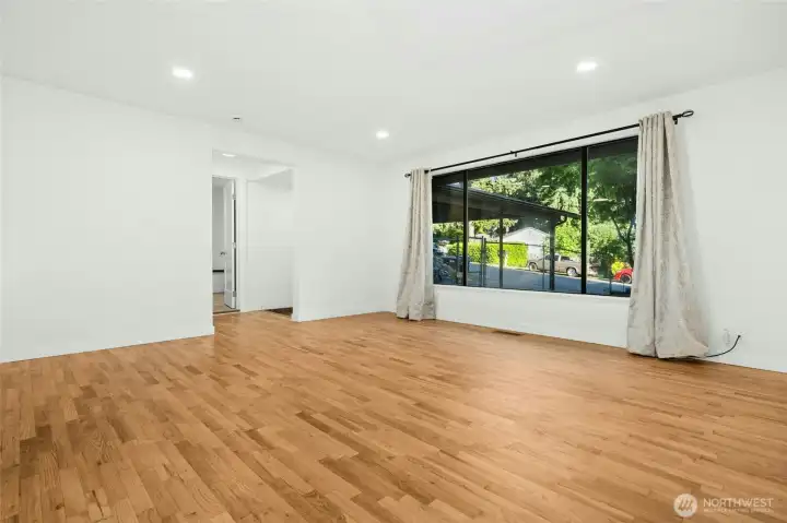 Large picture window in the living room. Refinished hardwoods in most of the home