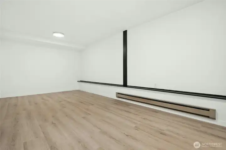 Primary bedroom with new bathroom and LVP flooring