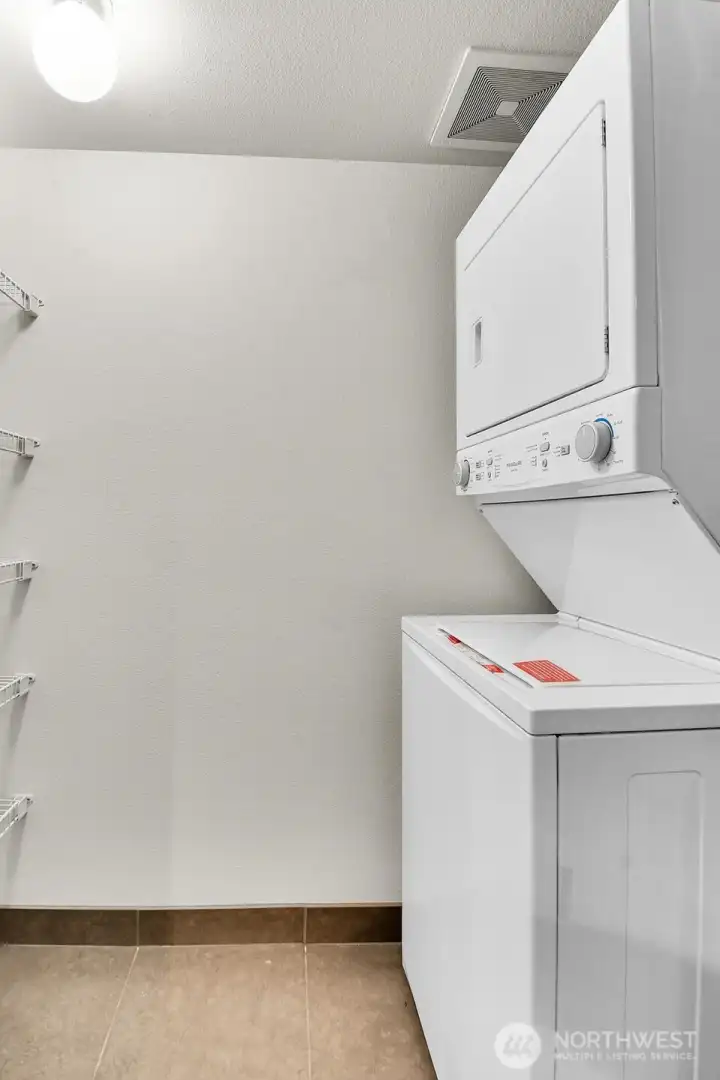 In unit laundry and storage area. In unit laundry and storage area.