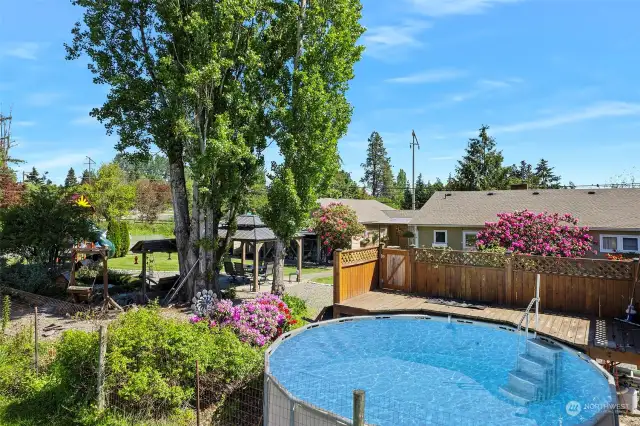 ~Relax & take a dip in the above ground pool w/custom built wooden deck & secure door to keep the kiddos safe~