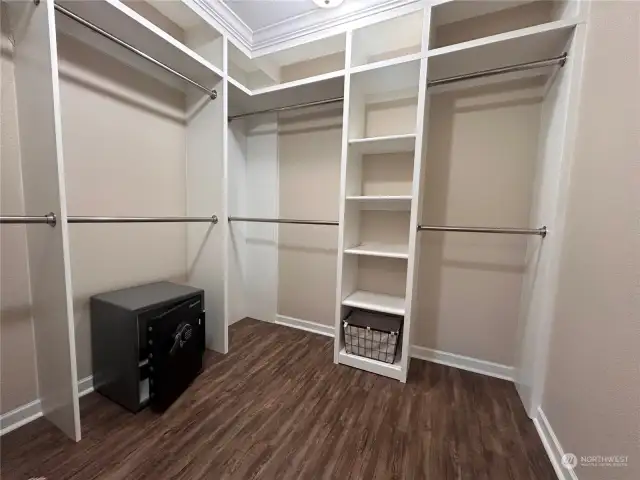 Primary bedroom boasts a spacious walk-in closet with built-ins for shoes, clothes, laundry, etc.