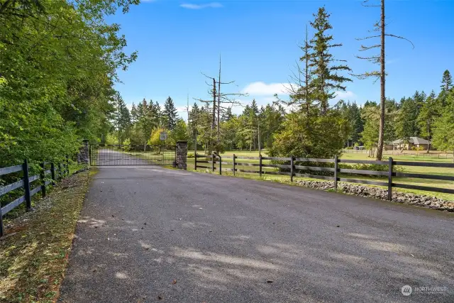Gated entrance with a shared paved driveway. The community consists of 4 homes. The home welcomes you!