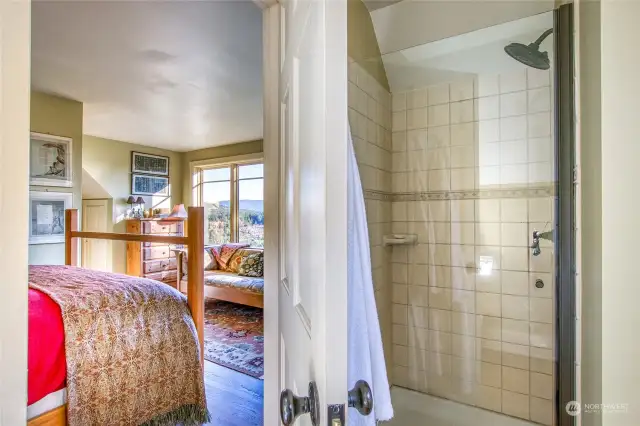 Tile shower in the upstairs bath