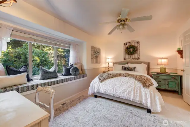 Guest bedroom with 3/4 on-suite bathroom and lovely window bench.