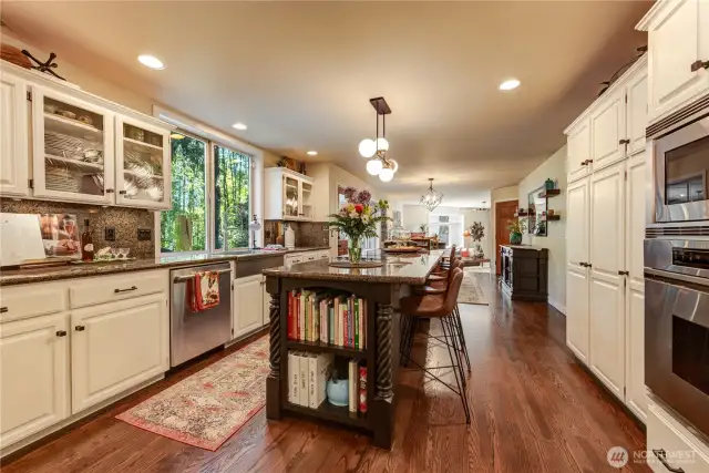 Simply gorgeous expansive kitchen. Solid hardwood floors, stainless steel appliances, granite counter tops, full backsplash, center island and work station.