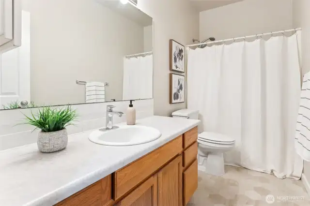 Guest bathroom with large vanity.