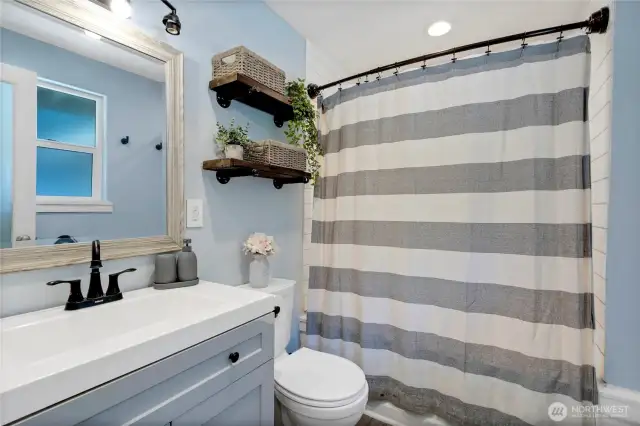 Ensuite primary bath with shower tub.