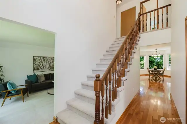 Double height entry and stairs highlight brand new carpeting