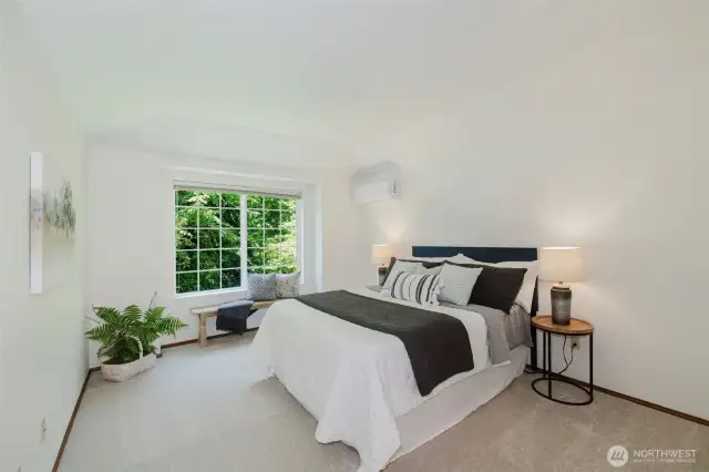 Primary bedroom overlooking front yard