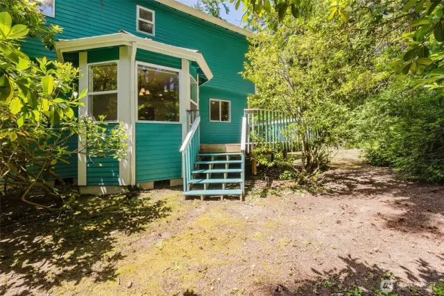Stairs from deck flow seamlessly to yard and gardens