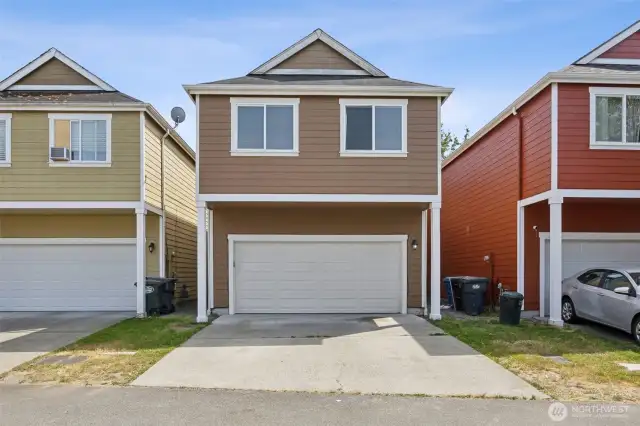 Back of home with 2 car garage