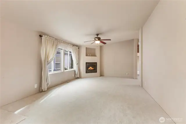 Here is 2nd entry view of large family room with cozy propane gas fireplace and lots of new light carpeting to enjoy