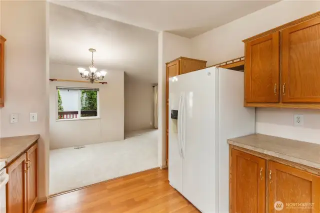 Kitchen view of good sized dining eating area off kitchen and front of home