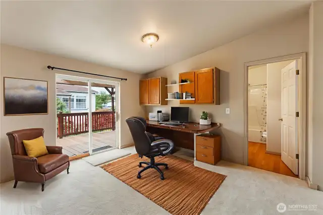 Here is view of virtually staged large office or bonus media room