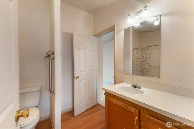 2nd bathroom view with door to office bonus room and kitchen